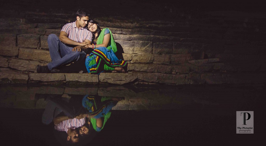 couple reflection in pond
