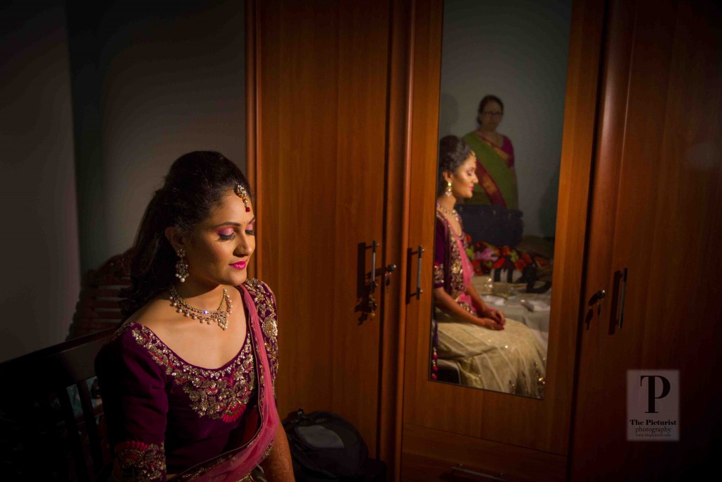 Bride in her makeup and evening lehenga