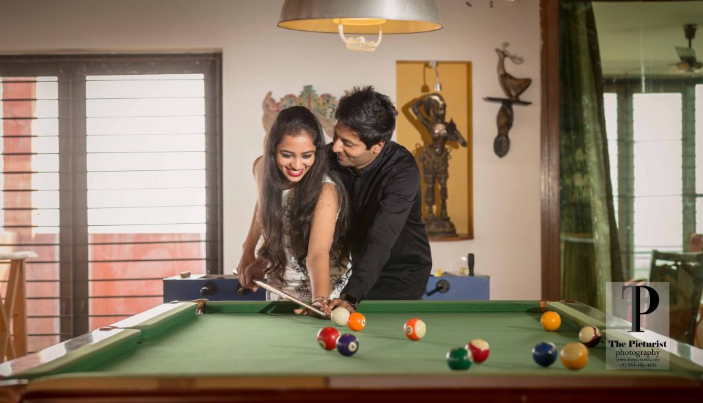 couple playing pool